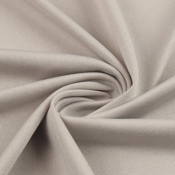 Elastisk bundet softshell-stoff